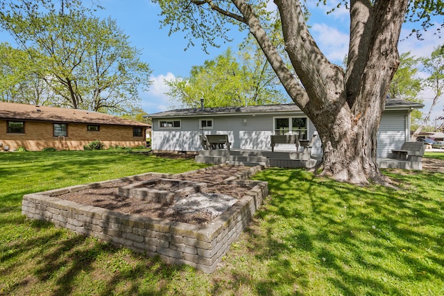 310 S Elm St, Saint Joseph, IL 61873 - back of house with a lawn