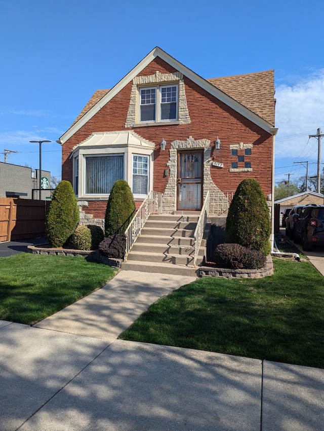 7172 W Armitage Ave, Chicago, IL 60707 - bungalow-style house featuring a front lawn and brick siding