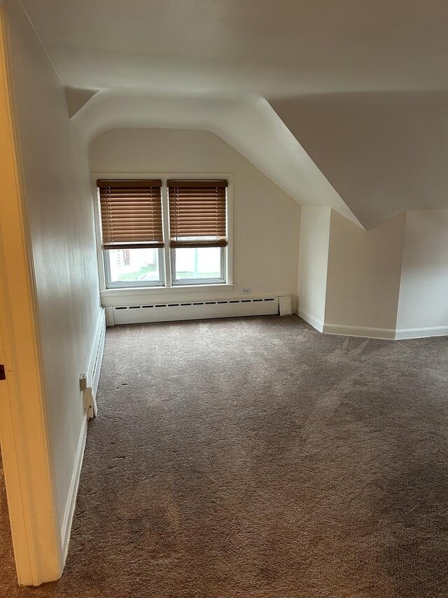 7172 W Armitage Ave, Chicago, IL 60707 - bonus room with baseboards, carpet, a baseboard heating unit, and vaulted ceiling