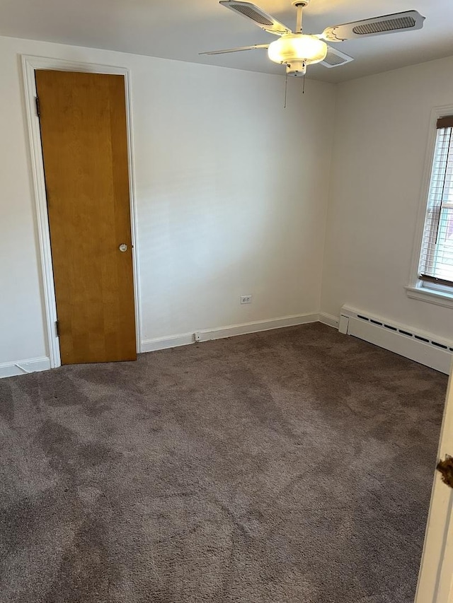 7172 W Armitage Ave, Chicago, IL 60707 - spare room featuring carpet floors, ceiling fan, a baseboard heating unit, and baseboards