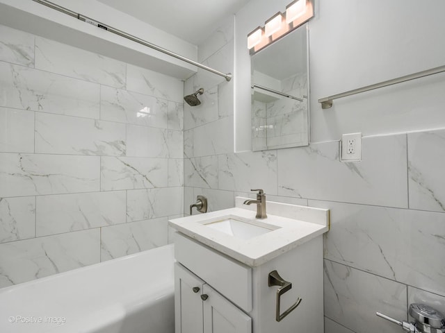 full bathroom featuring tile walls, vanity, and bathing tub / shower combination