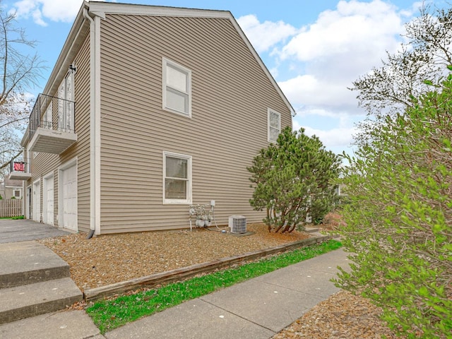 121 Foxhill Ct Unit D, New Lenox, IL 60451 - view of side of property featuring a balcony and a garage