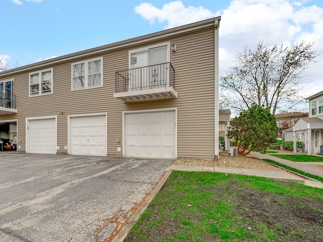 121 Foxhill Ct Unit D, New Lenox, IL 60451 - multi unit property featuring an attached garage, driveway, central AC, and a balcony