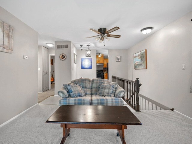 121 Foxhill Ct Unit D, New Lenox, IL 60451 - living area featuring visible vents, baseboards, ceiling fan, and light colored carpet