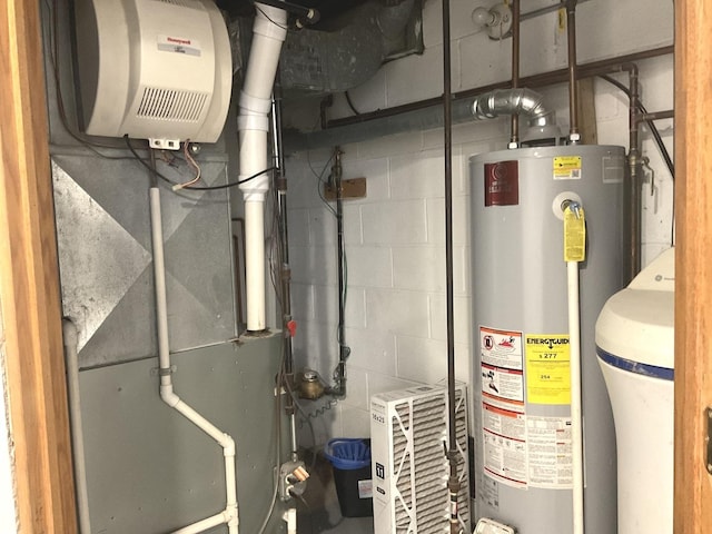 utility room with gas water heater