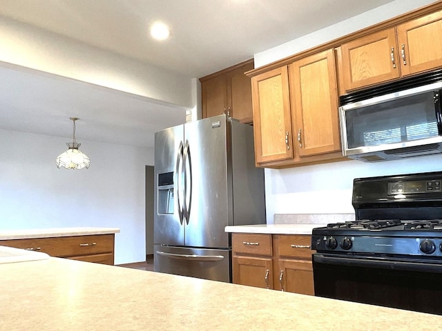 kitchen with light countertops, brown cabinetry, stainless steel appliances, and decorative light fixtures