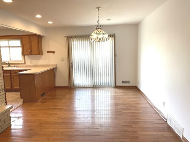 unfurnished room with baseboards, ceiling fan, and visible vents
