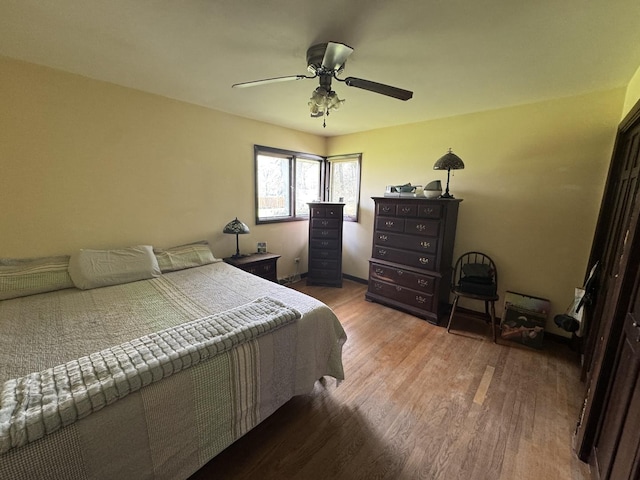 bedroom featuring ceiling fan and wood finished floors