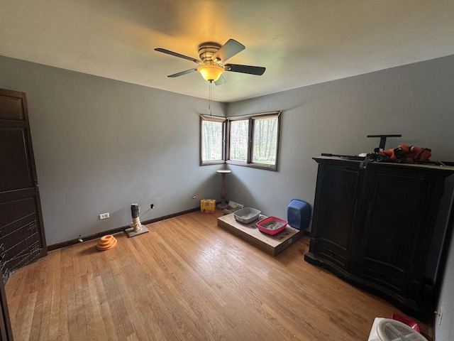 bedroom featuring light wood-type flooring and ceiling fan