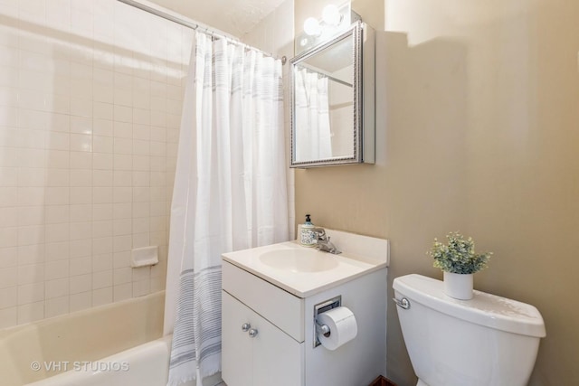bathroom with toilet, shower / tub combo with curtain, and vanity