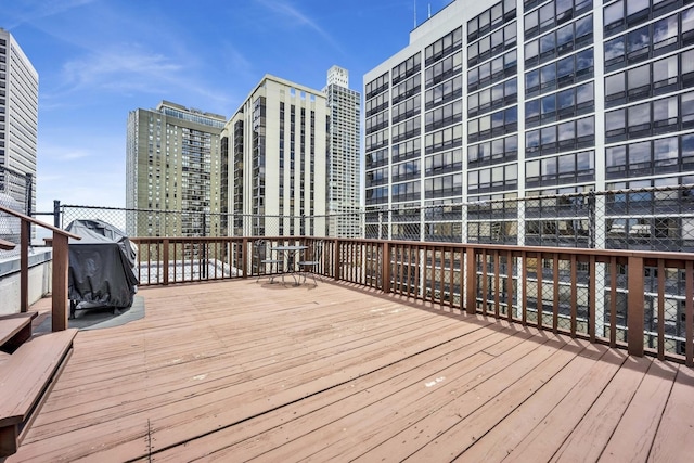 wooden deck featuring a city view