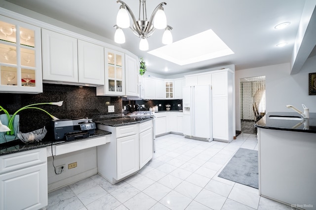 14650 Lamon Ave, Midlothian, IL 60445 - kitchen featuring an inviting chandelier, white refrigerator with ice dispenser, white cabinetry, a sink, and backsplash