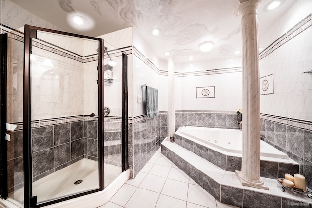 14650 Lamon Ave, Midlothian, IL 60445 - bathroom featuring tile walls, decorative columns, a whirlpool tub, and a stall shower