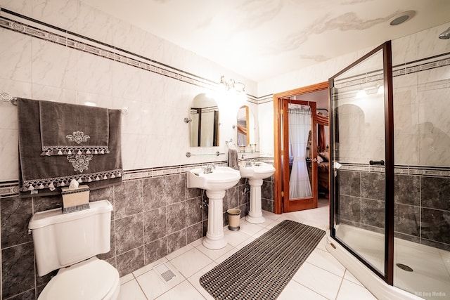 14650 Lamon Ave, Midlothian, IL 60445 - full bath with toilet, tile walls, tile patterned flooring, and a stall shower