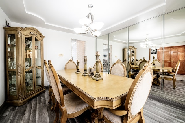 14650 Lamon Ave, Midlothian, IL 60445 - dining area featuring a tray ceiling, wood finished floors, and a notable chandelier
