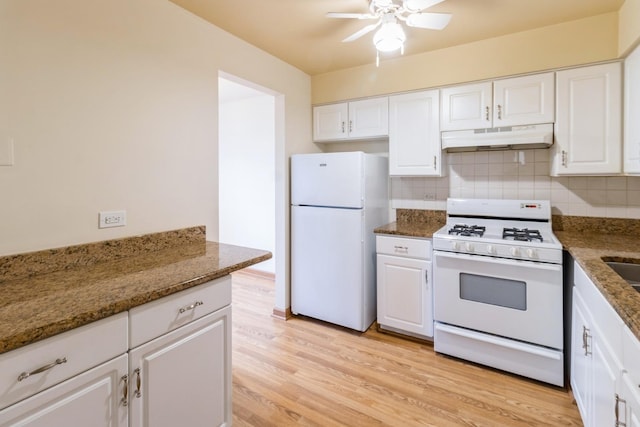 kitchen with white appliances, a ceiling fan, under cabinet range hood, and white cabinetry