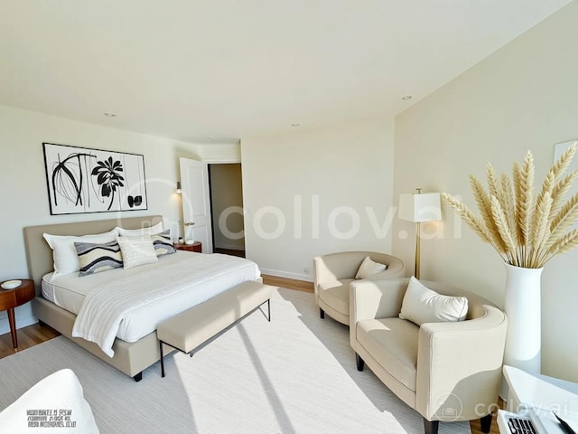 bedroom with light wood-style flooring and baseboards