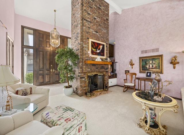 living room with visible vents, a fireplace, a high ceiling, and carpet floors