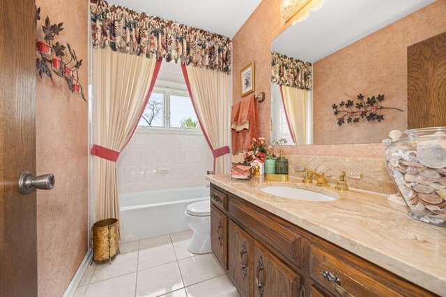 full bathroom featuring vanity, toilet, and tile patterned floors