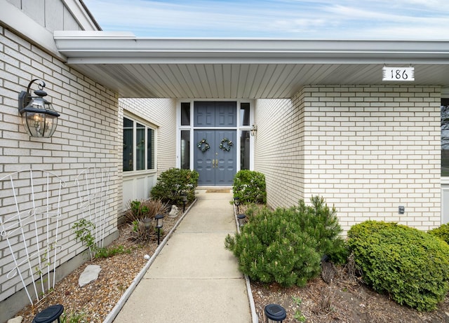 entrance to property with brick siding