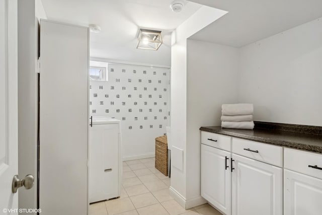 bathroom with tile patterned flooring and washer / clothes dryer