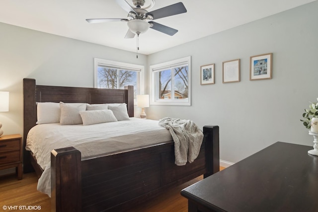 bedroom with a ceiling fan and wood finished floors