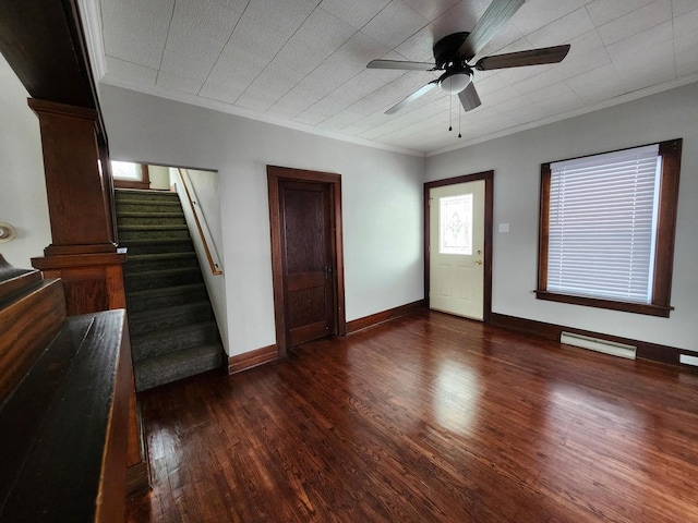 257 S Alma Ave, Kankakee, IL 60901 - interior space with a ceiling fan, baseboard heating, dark wood finished floors, baseboards, and stairs