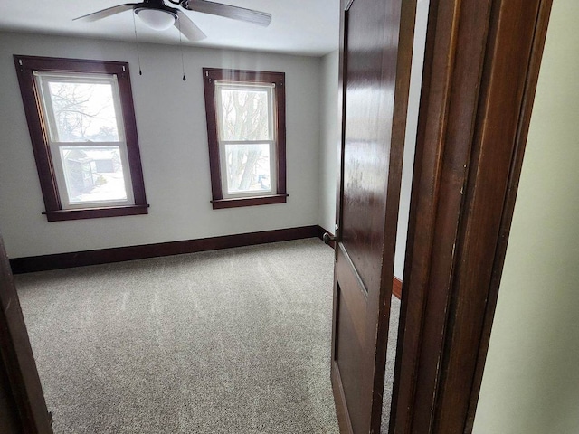 257 S Alma Ave, Kankakee, IL 60901 - carpeted empty room with baseboards and ceiling fan