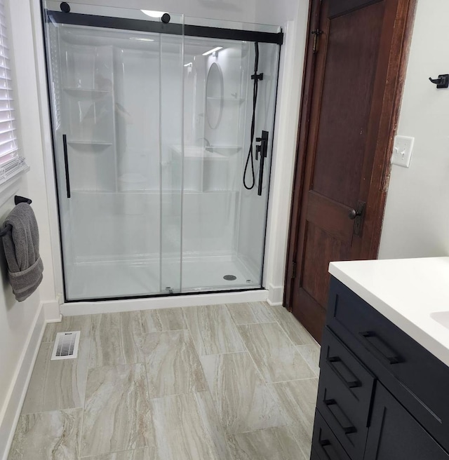 257 S Alma Ave, Kankakee, IL 60901 - full bathroom with baseboards, visible vents, a shower stall, and vanity