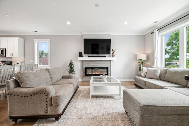 7230 W Belden Ave Unit 3, Elmwood Park, IL 60707 - living area with a glass covered fireplace, light wood-style floors, healthy amount of natural light, crown molding, and recessed lighting