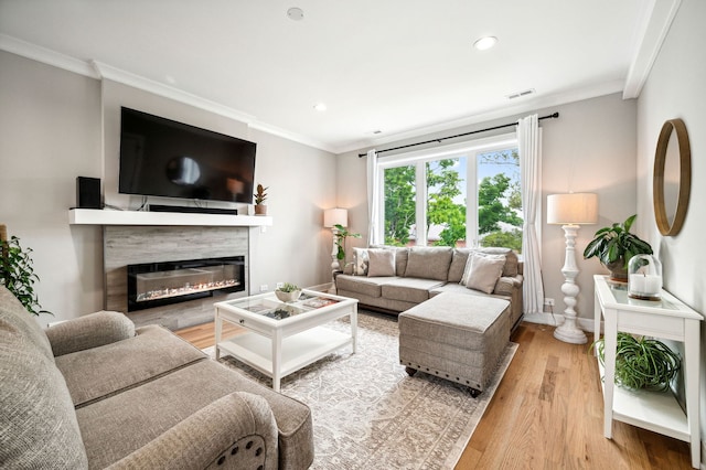 7230 W Belden Ave Unit 3, Elmwood Park, IL 60707 - living area with a glass covered fireplace, light wood-style floors, recessed lighting, crown molding, and baseboards