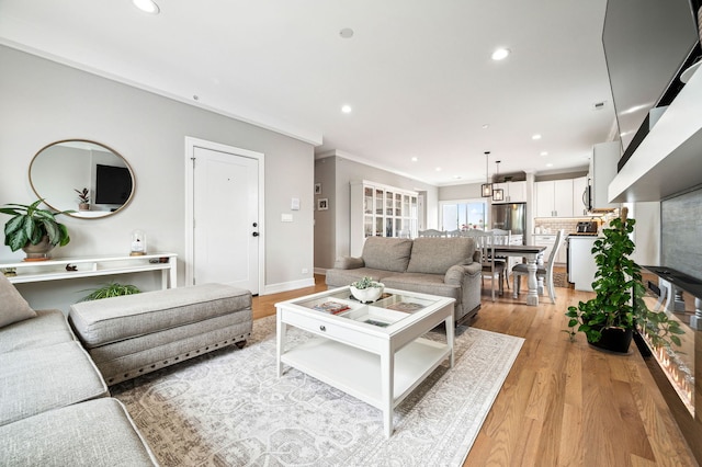 7230 W Belden Ave Unit 3, Elmwood Park, IL 60707 - living area featuring light wood-type flooring, recessed lighting, crown molding, and baseboards
