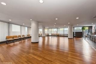 workout room featuring recessed lighting and wood finished floors