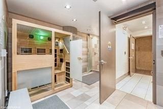 bathroom featuring recessed lighting and tile patterned flooring