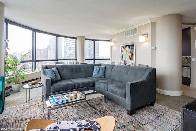 living area with visible vents, a city view, and baseboards