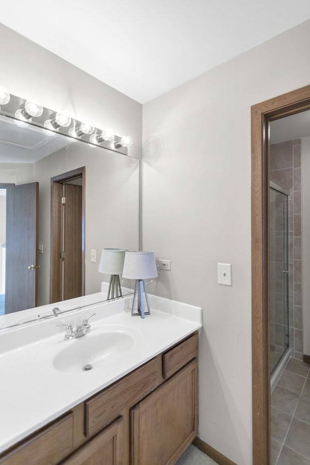 1100 E Cambria Ln, Lombard, IL 60148 - bathroom featuring a stall shower, vanity, tile patterned flooring, and baseboards