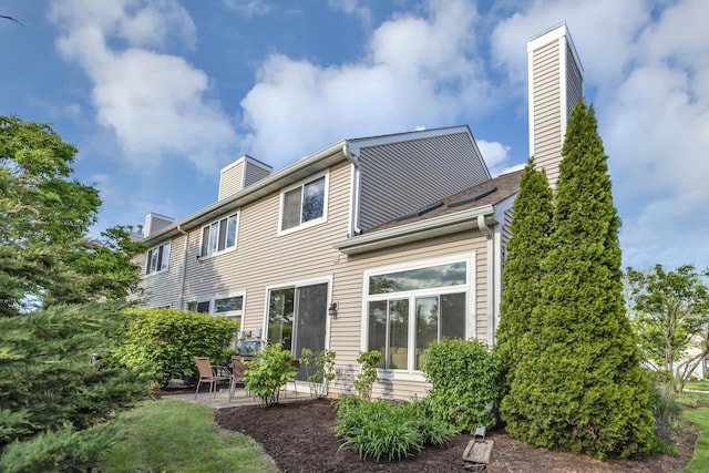 1100 E Cambria Ln, Lombard, IL 60148 - back of property with a chimney and a patio