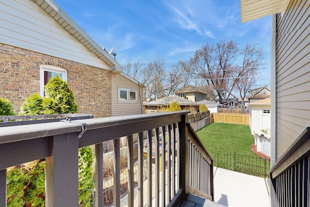 5650 W Grace St, Chicago, IL 60634 - wooden terrace with fence, a yard, and a residential view