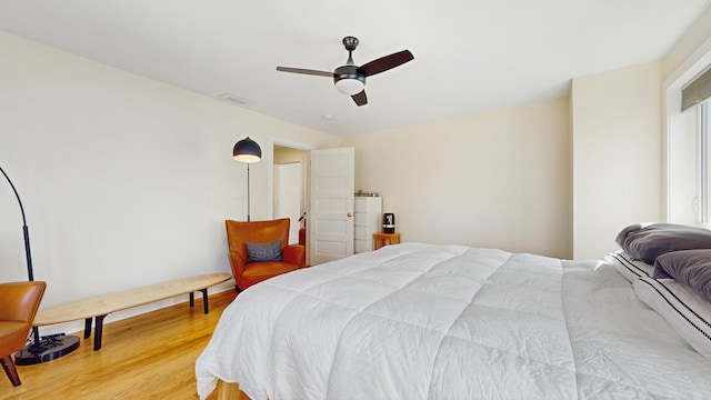 5650 W Grace St, Chicago, IL 60634 - bedroom featuring ceiling fan, light wood-type flooring, and visible vents