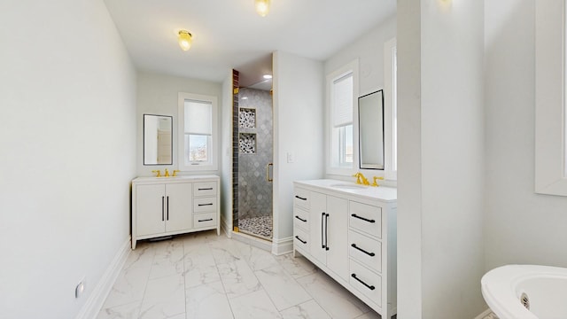 5650 W Grace St, Chicago, IL 60634 - full bathroom featuring marble finish floor, baseboards, two vanities, a shower stall, and a sink