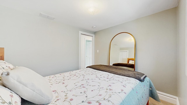 5650 W Grace St, Chicago, IL 60634 - bedroom featuring baseboards, carpet, and visible vents