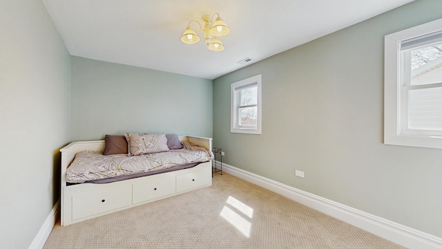 5650 W Grace St, Chicago, IL 60634 - bedroom with visible vents, carpet, baseboards, and multiple windows