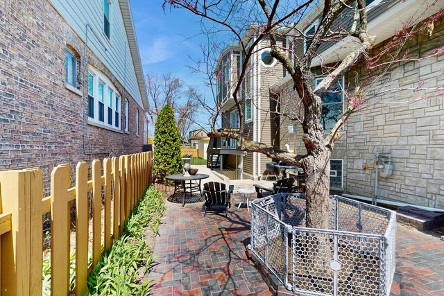 5650 W Grace St, Chicago, IL 60634 - view of patio featuring fence and outdoor dining space