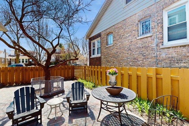5650 W Grace St, Chicago, IL 60634 - view of patio featuring fence
