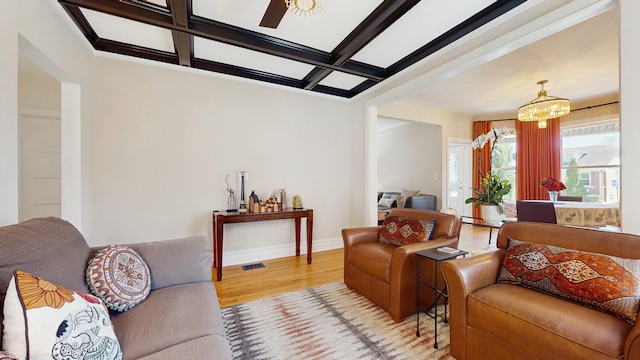 5650 W Grace St, Chicago, IL 60634 - living room featuring wood finished floors, beam ceiling, baseboards, a chandelier, and coffered ceiling