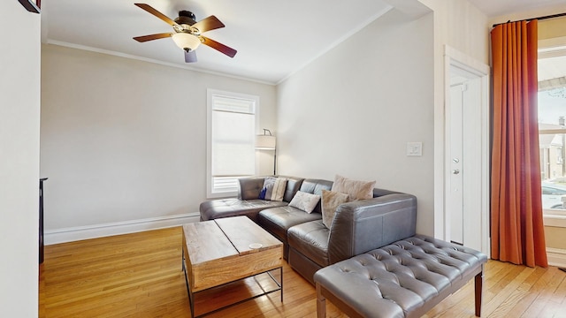 5650 W Grace St, Chicago, IL 60634 - living area with ceiling fan, a wealth of natural light, and light wood-style floors
