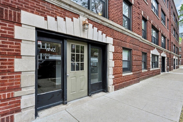 1247 W Roscoe St Unit 2, Chicago, IL 60657 - entrance to property with brick siding