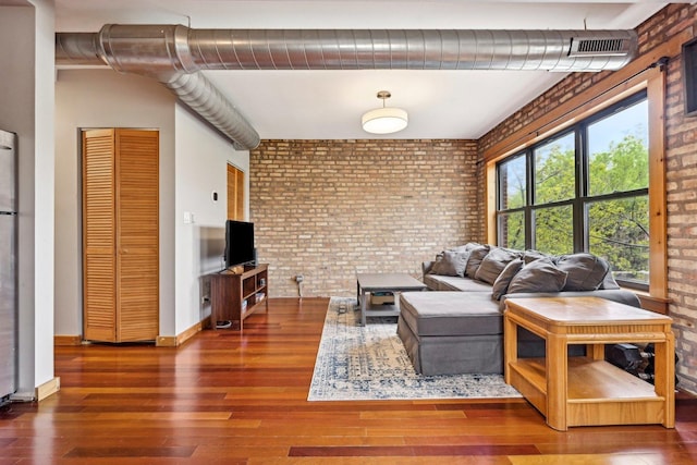 1247 W Roscoe St Unit 2, Chicago, IL 60657 - living room with brick wall, hardwood / wood-style flooring, and baseboards