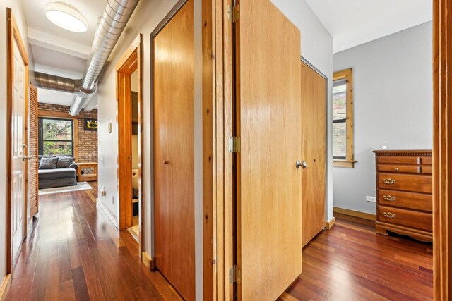 1247 W Roscoe St Unit 2, Chicago, IL 60657 - hall featuring dark wood-style floors and baseboards