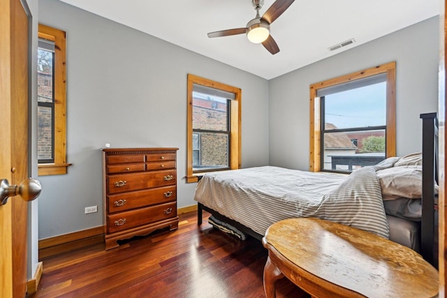 1247 W Roscoe St Unit 2, Chicago, IL 60657 - bedroom with dark wood-type flooring, multiple windows, baseboards, and a ceiling fan